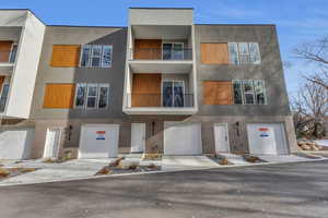 View of building exterior with a garage