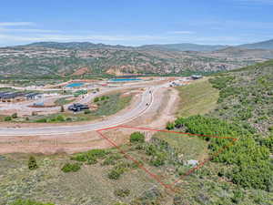 Birds eye view of property with a mountain view