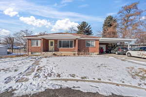 Ranch-style home with a carport