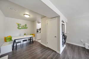 Interior space featuring dark wood-type flooring