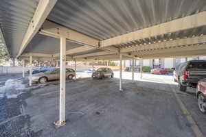 Garage featuring a carport