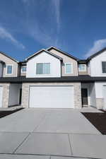 View of front of property with a garage