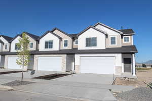 View of front of property with a garage