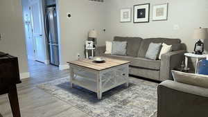 Living room with hardwood / wood-style floors