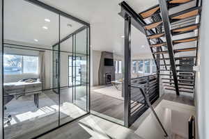 Interior space with plenty of natural light and hardwood / wood-style floors