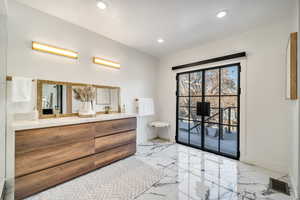 Primary suite bathroom featuring vanity