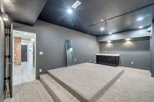 Spare room with light hardwood / wood-style floors and rail lighting