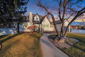 View of front of property with a yard