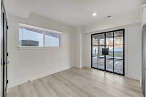 Spare room with light hardwood / wood-style flooring