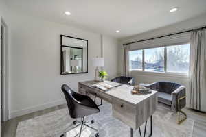 Office area featuring light wood-type flooring