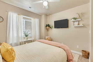 Bedroom featuring ceiling fan