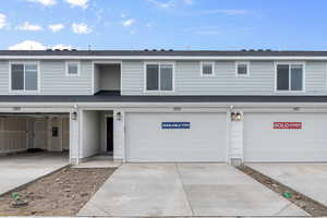 View of front of property featuring a garage