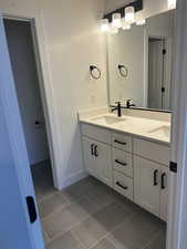 Bathroom featuring vanity and tile patterned floors