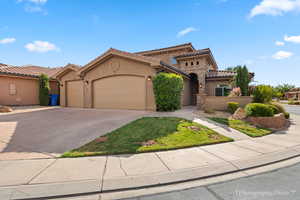 Mediterranean / spanish-style home featuring a garage