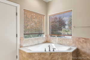 Bathroom featuring tiled tub