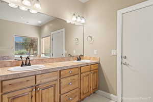 Bathroom featuring vanity and tile patterned floors