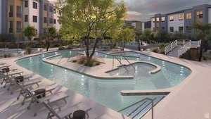 Pool at dusk with a patio area