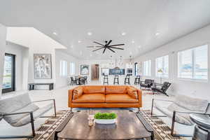 Living room featuring light hardwood / wood-style flooring and a healthy amount of sunlight