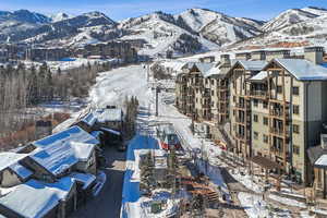 Snowy aerial view up-mountain to resort