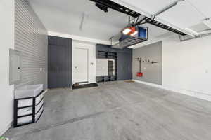 Spacious 2-car garage with storage cabinets and walls