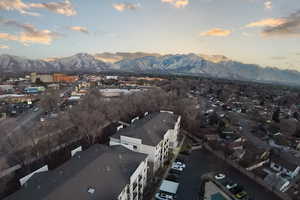 Aerial view at dusk featuring a mountain view