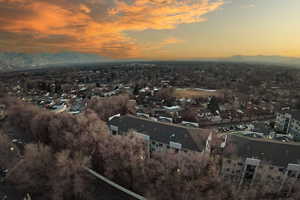 Aerial view at dusk featuring a mountain view