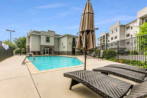 View of swimming pool with a patio