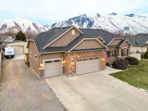 View of front of home featuring a garage and a mountain view