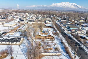 Snowy aerial view with a mountain view