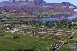 Aerial view featuring a water and mountain view