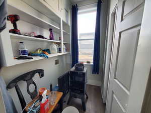 Interior space featuring washer hookup and dark hardwood / wood-style flooring