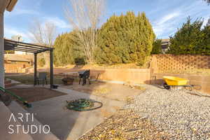 View of patio / terrace with area for grilling, an outdoor fire pit, and a pergola