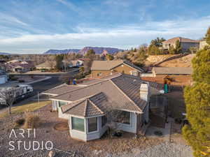 Birds eye view of property with a mountain view