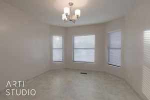 Spare room with a chandelier