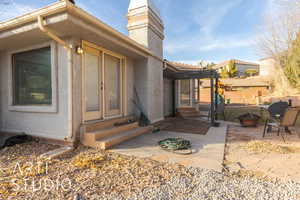 Property entrance with a patio