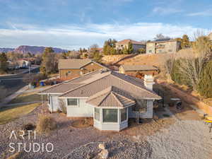 Birds eye view of property with a mountain view