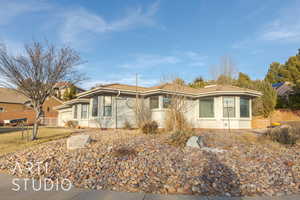 View of front of property featuring a garage