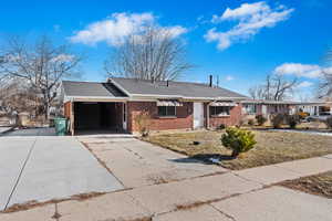 Ranch-style house featuring a carport