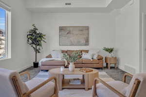 Living room featuring light colored carpet