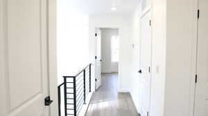 Corridor with light hardwood / wood-style floors