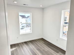 Unfurnished room featuring wood-type flooring