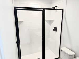 Bathroom with toilet and walk in shower