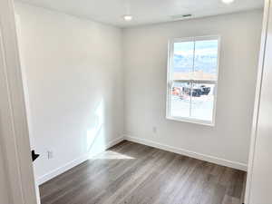 Spare room featuring hardwood / wood-style floors