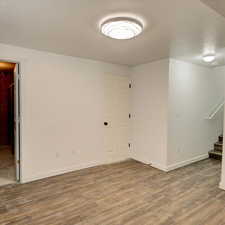 Empty room featuring wood-type flooring