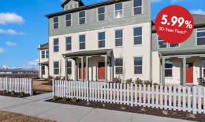 View of front of house with a fenced front yard and a mountain view