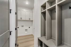 Mudroom with light hardwood / wood-style flooring