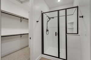 Bathroom featuring a shower with door