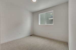 Unfurnished room featuring carpet floors