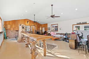 Interior space featuring vaulted ceiling and ceiling fan