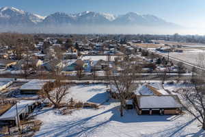 Snowy aerial view with a mountain view